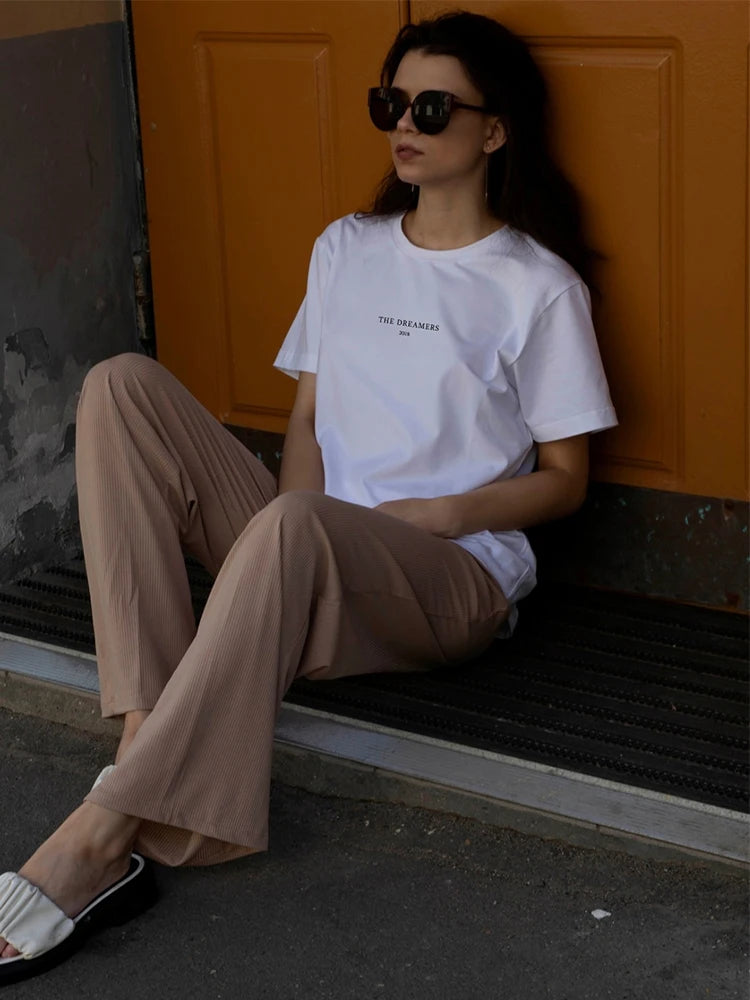 Model wearing the white Women's Loose Printed T-shirt