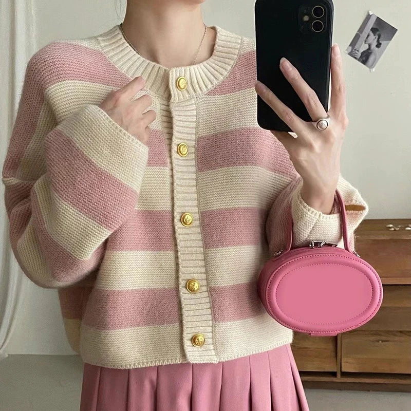 Model wearng the pink Striped Button-Up Sweater