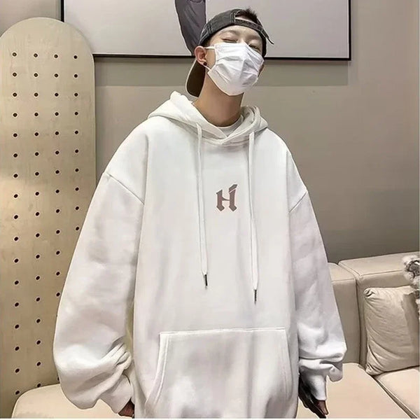 Model wearing the white Baggy Logo Hoodie 