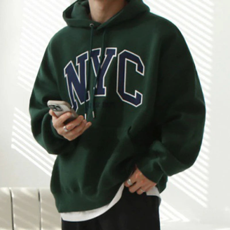 Model wearing the dark green Urban Nomad Hoodie 