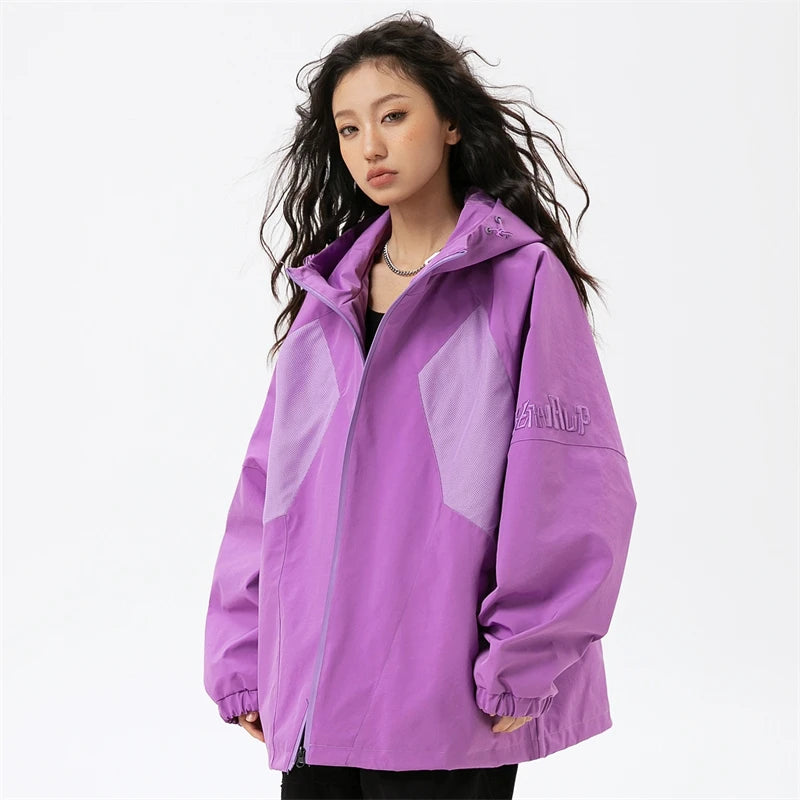 A girl wearing the purple Patchwork Solid Thin Windbreaker Jacket from DAXUEN.