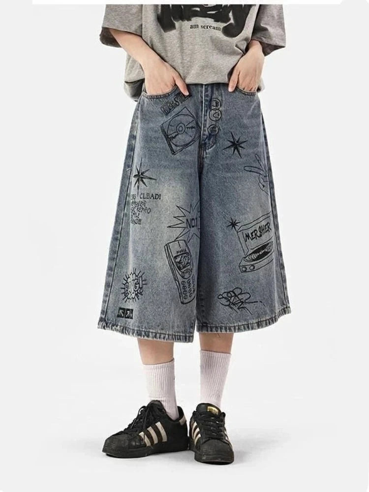 A model wearing the blue Y2K Women's Printed Washed Jorts in a gray background 