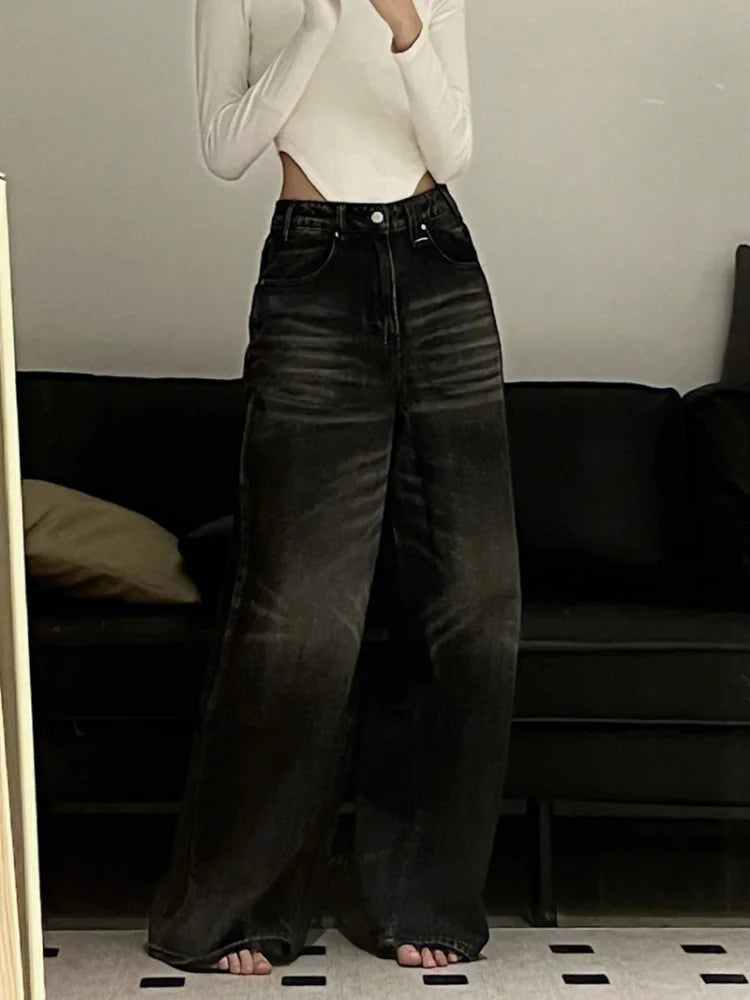 Model wearing the black Distressed Wide-Leg Jeans