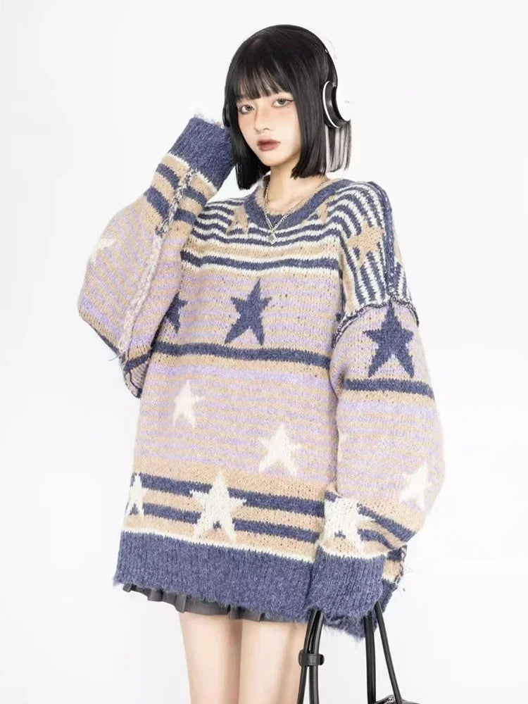 Model wearing the purple Starry Strips Oversized Sweater in a gray background