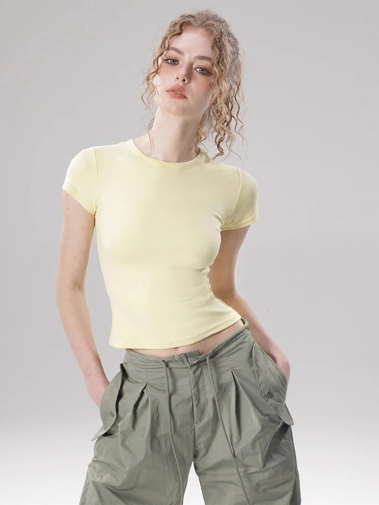 Model wearing the yellow Women's Basic Solid Color T-shirt