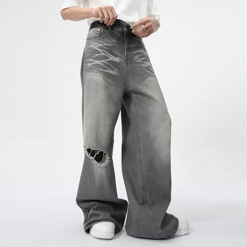 Model wearing the gray Vintage Distressed Baggy Jeans