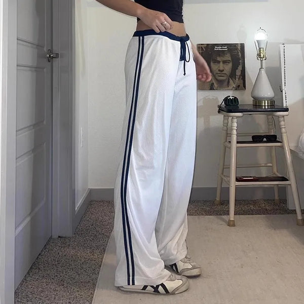 Model wearing the white Wide-Leg Athletic Pants 