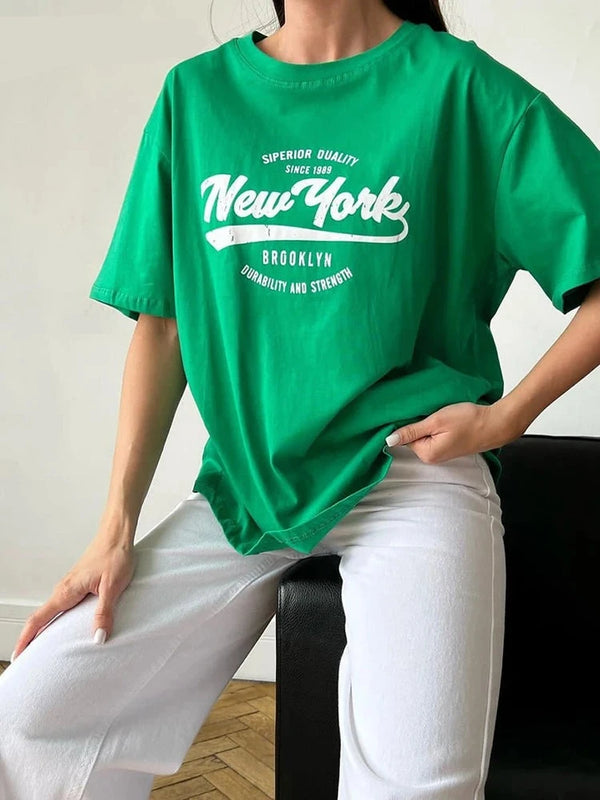 Model wearing the green Vibrant New York Graphic T-shirt 