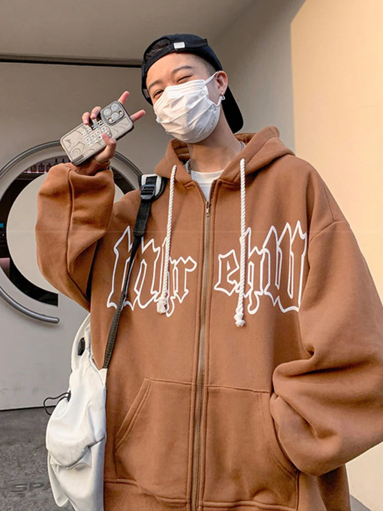 Model wearing the brown Gothic Arch Hoodie