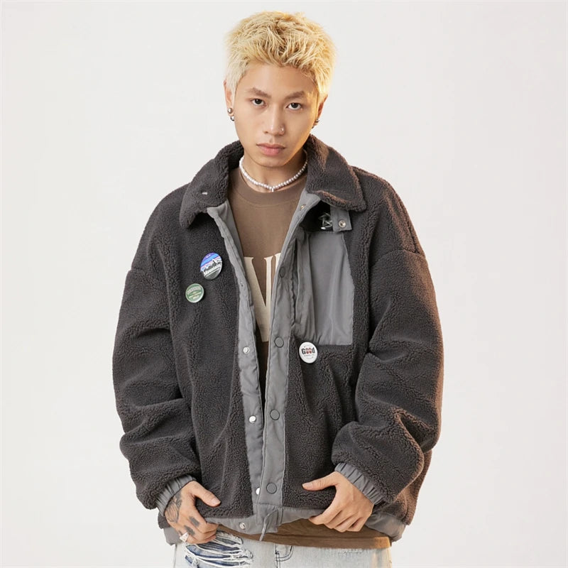 Model wearing the dark grey Arctic Breeze Puffer Jacket in a gray background