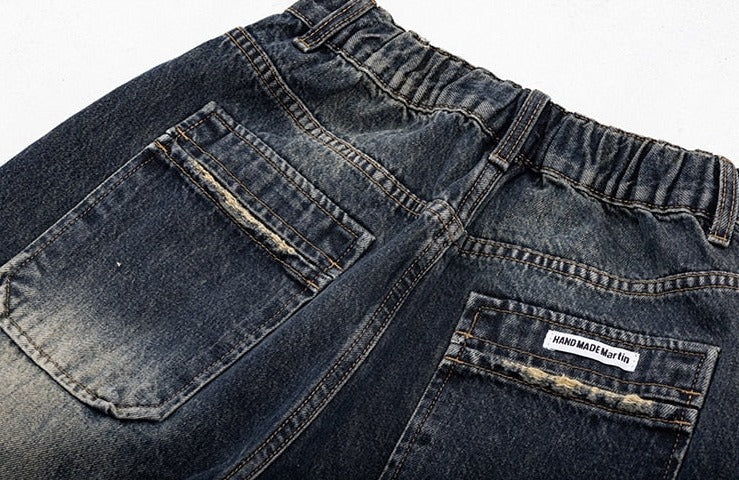 back pockets of the Vintage High Waist Women's Jeans in a gray background