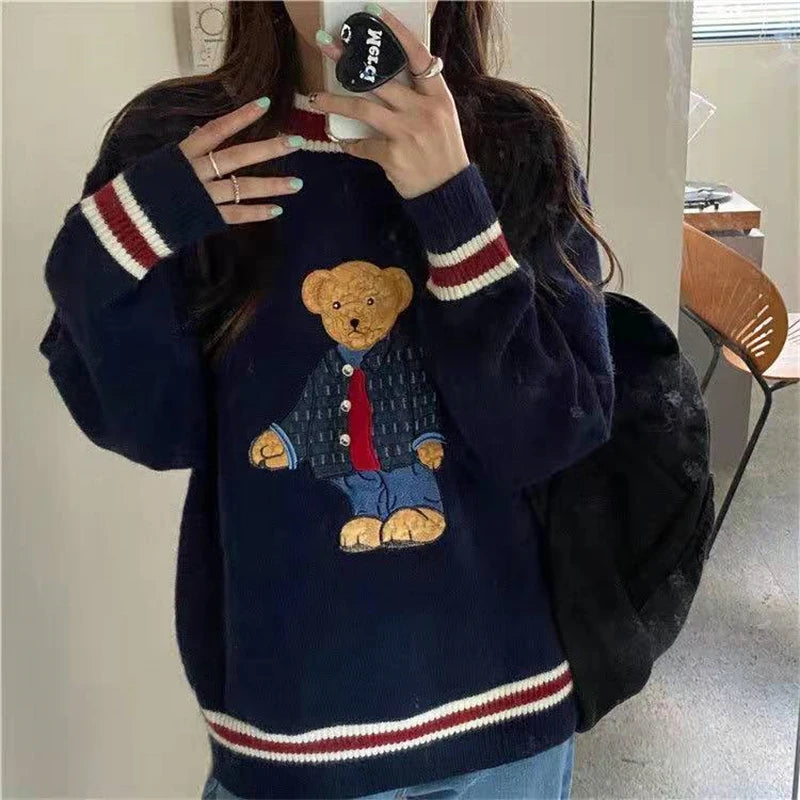 Model wearing the navy blue Teddy Bear Graphic Sweater