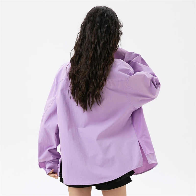 A girl showing the back view of the Women's Purple Rose T-shirt from DAXUEN.