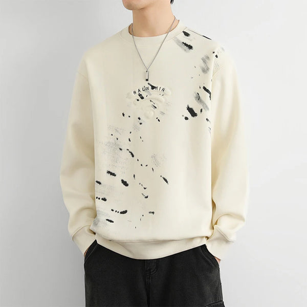 Model wearing the beige Abstract Paint Splatter Sweatshirt