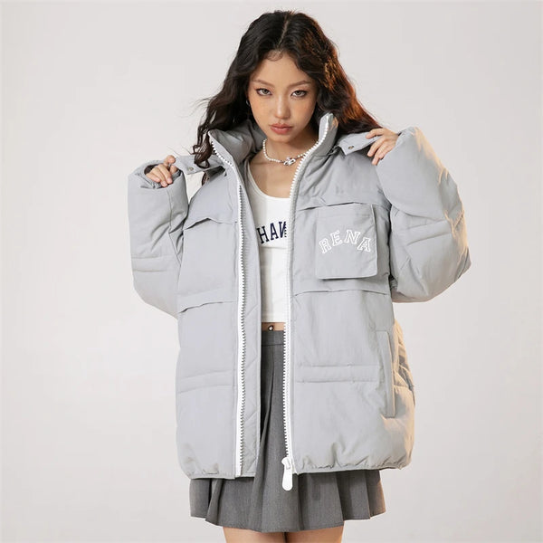 Model wearing the gray Solid Hooded Collar Puffer Jacket in a gray background