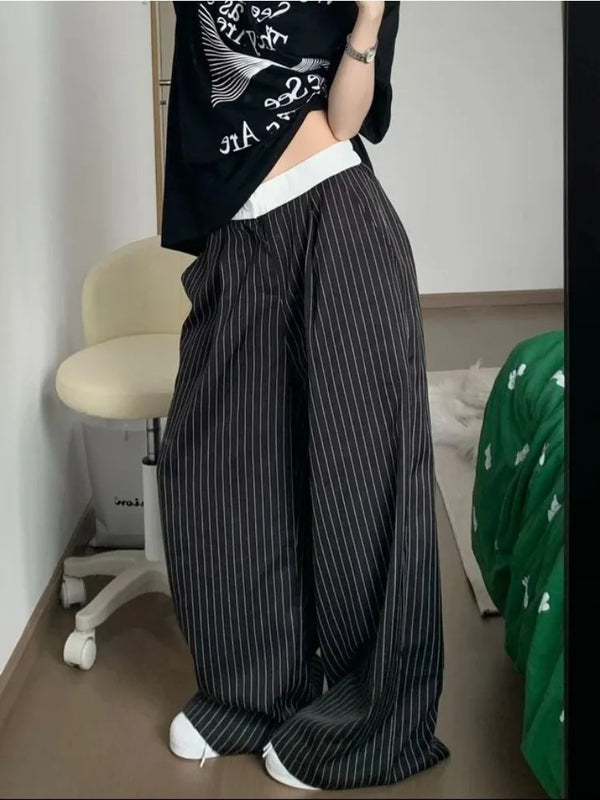 Model wearing the black Pinstripe Baggy Pants