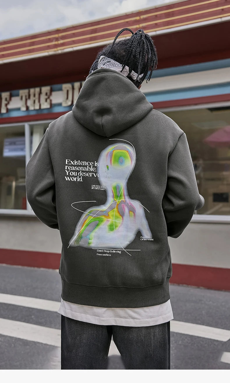 Back view of the model wearing the dark grey Alien Chill Graphic Hoodie