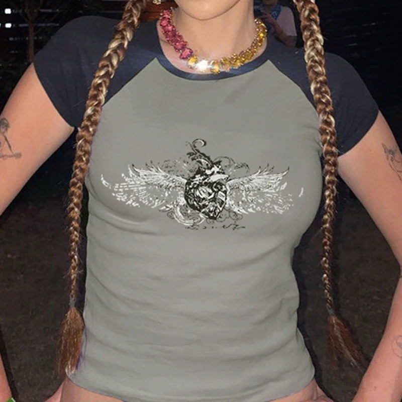 Model wearing the gray Winged Skull Emblem Graphic T-shirt 