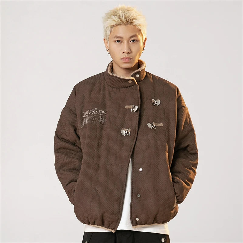 Model wearing the coffee Vintage Breeze Puffer Jacket in a gray background