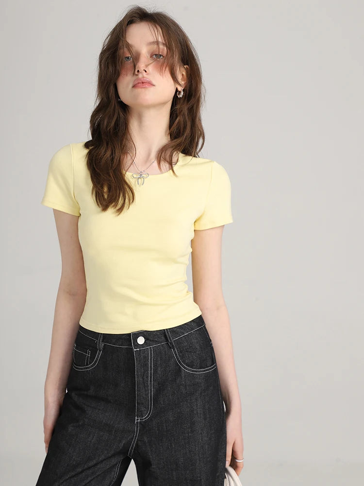 Model wearing the yellow Y2k Women's Slim T-shirt