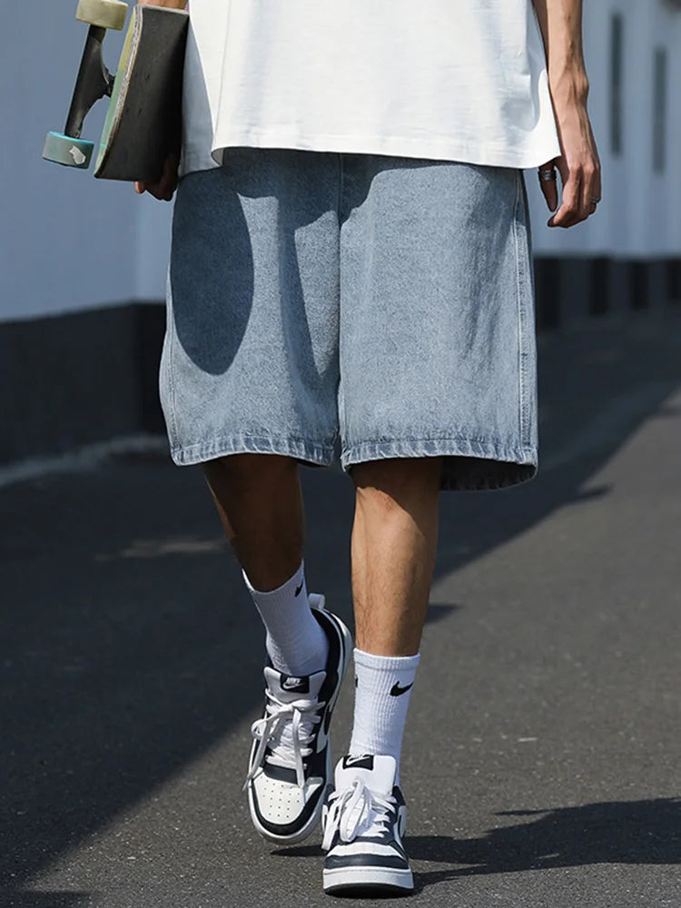 Model wearing the blue Baggy Drawstring Denim Shorts