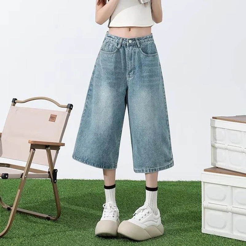 Model wearing the blue Retro Wide-Leg Jorts