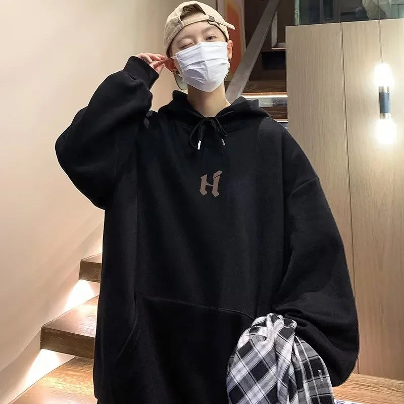 Model wearing the black Baggy Logo Hoodie 