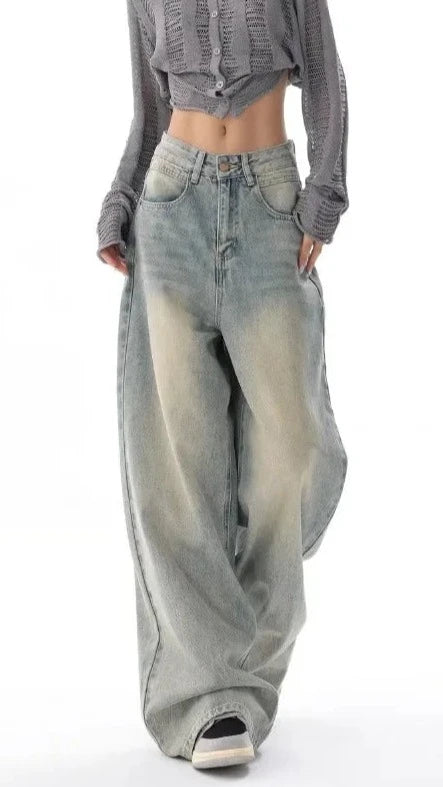 Model wearing the light blue Ultra Wide-Leg Baggy Denim Jeans in a gray background