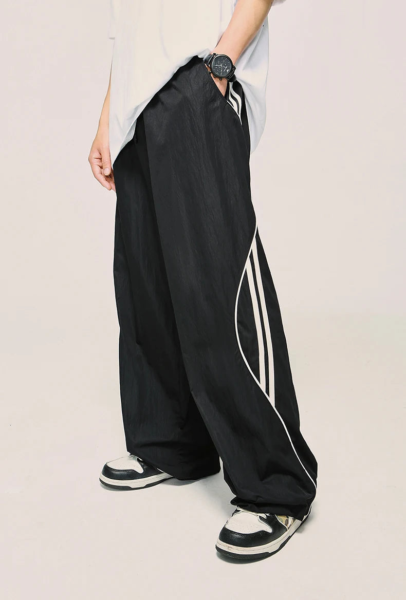 Model wearing the black Loose Side Striped Baggy Pants