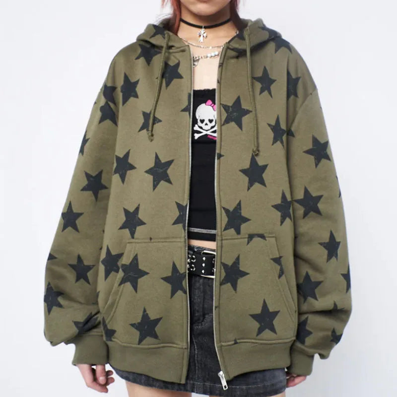 Model wearing the olive green Star-Print Oversized Sweatshirt in a gray background