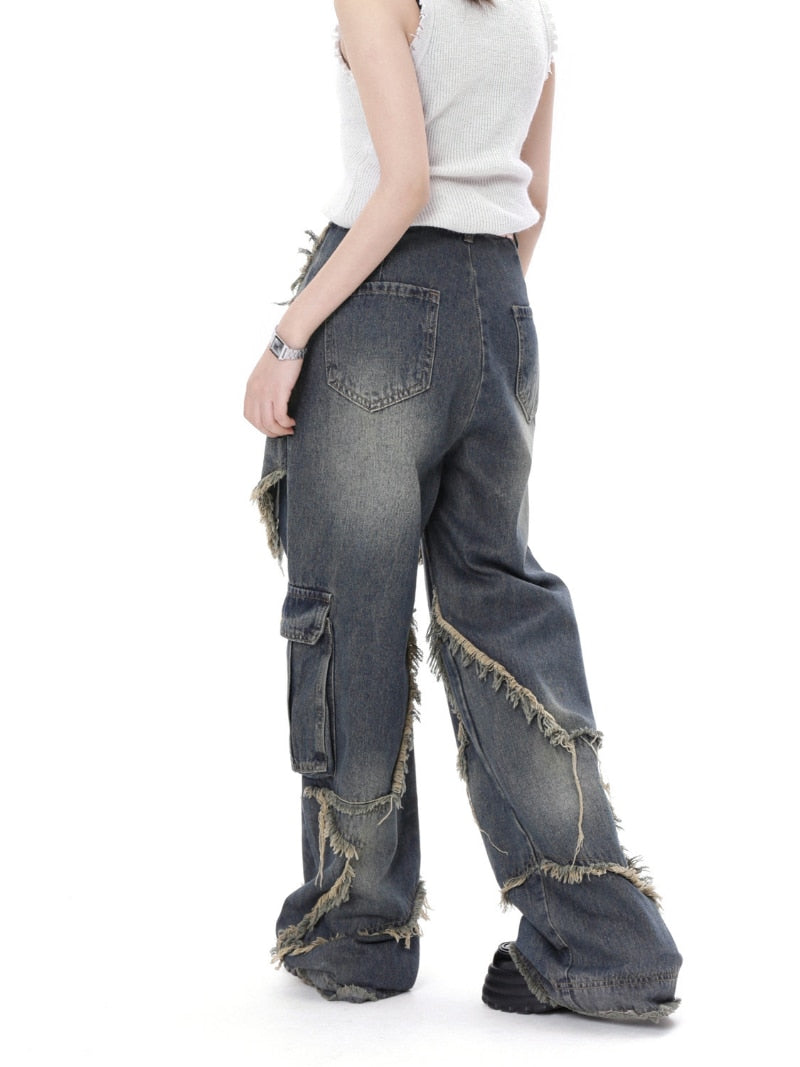 a model showing the back view of the Star Wide Leg Jeans in a gray background