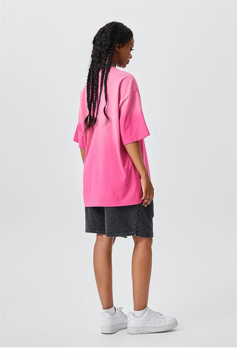 Front view of the pink Y2K Oversized Urban T-shirt in a gray background