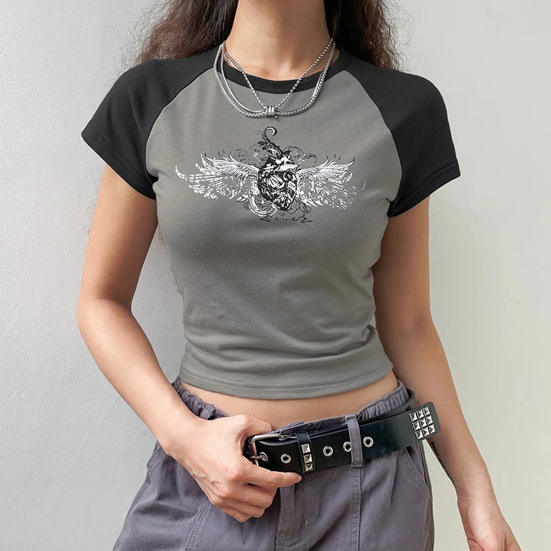 Model wearing the gray Winged Skull Emblem Graphic T-shirt 