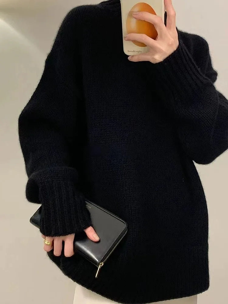 Model wearing the black Cozy Loose-Fit Sweater