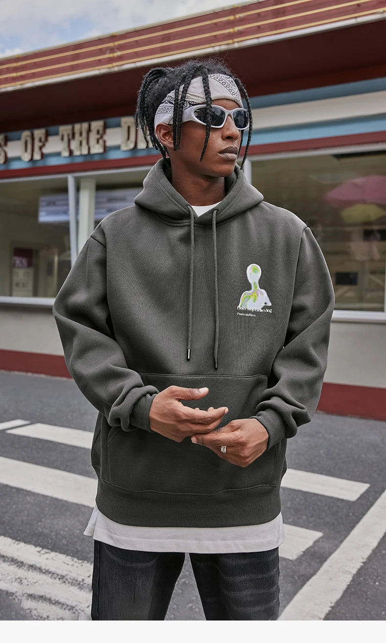 Model wearing the dark grey Alien Chill Graphic Hoodie