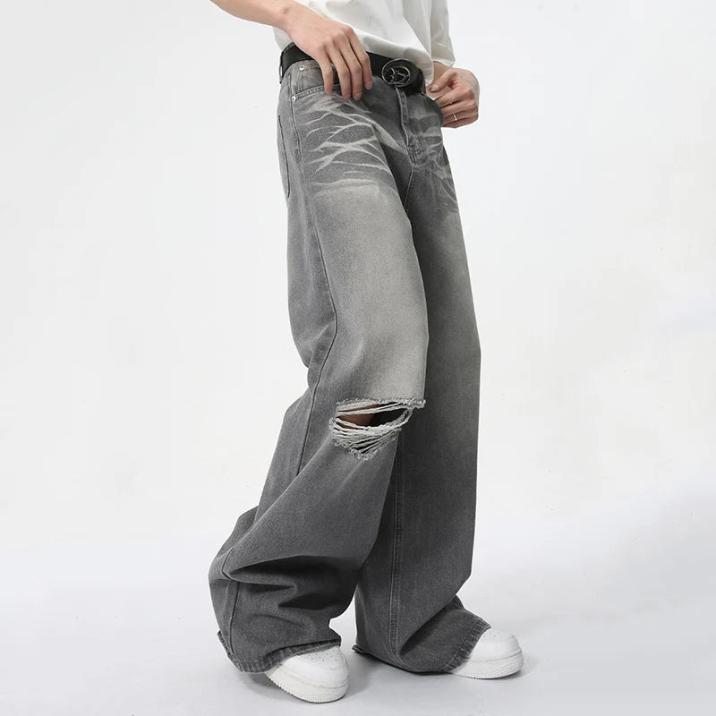 Model wearing the gray Vintage Distressed Baggy Jeans