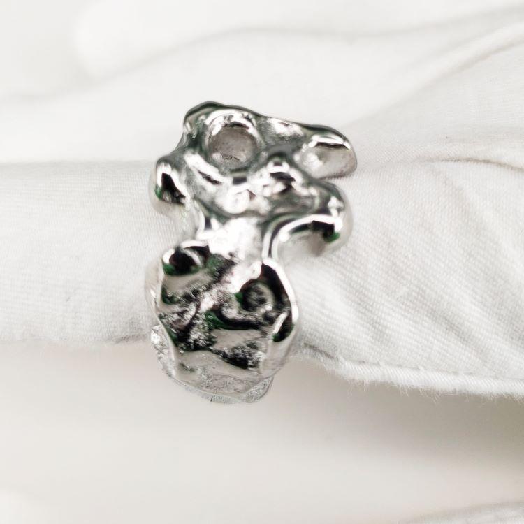 Front view of the white Skull Embrace Ring