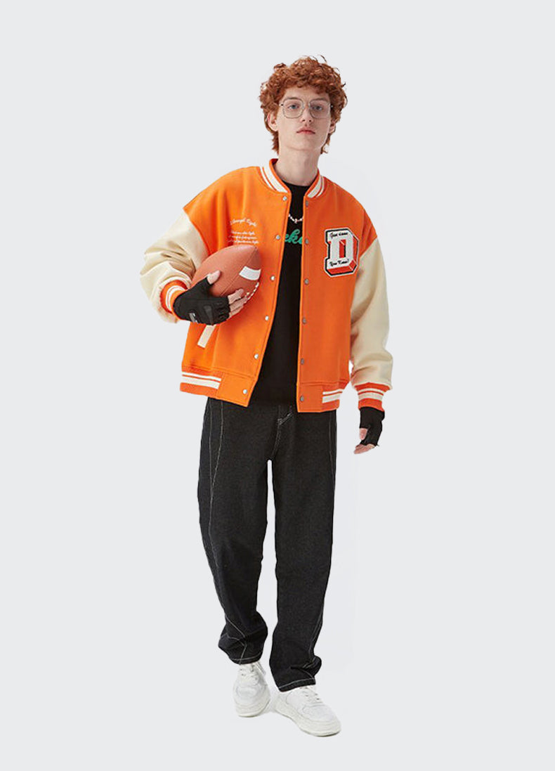 A guy wearing orange vintage varsity jacket