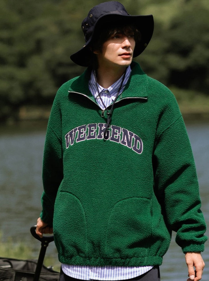 A guy wearing green Weekend Sweatshirt