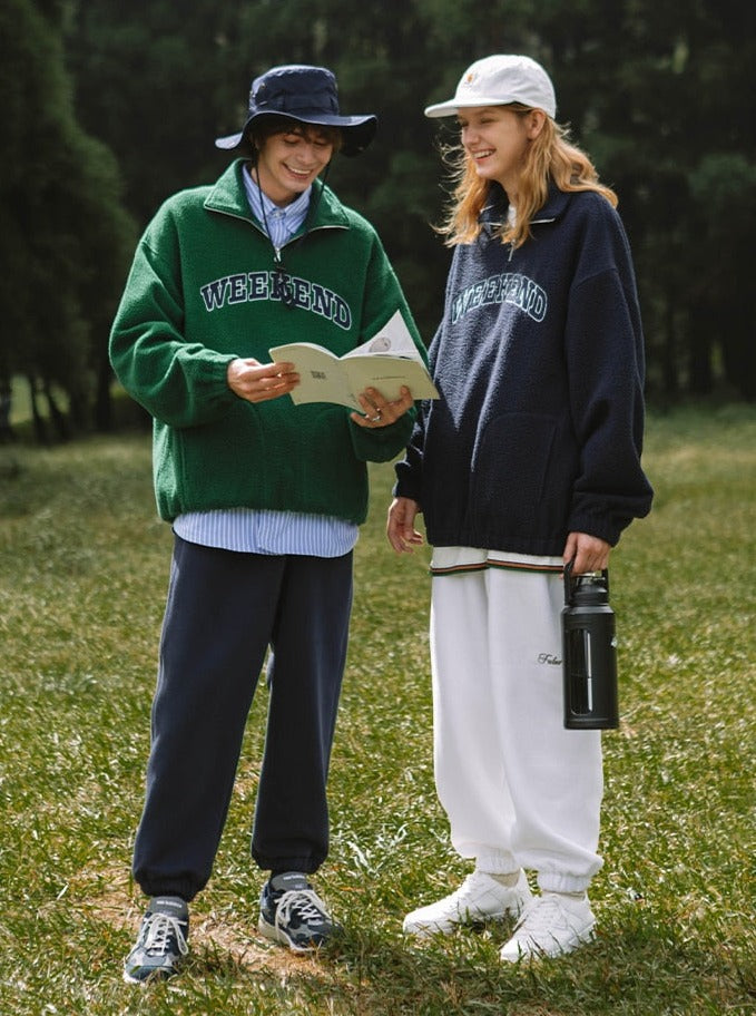 A guy and a girl wearing Weekend Sweatshirt