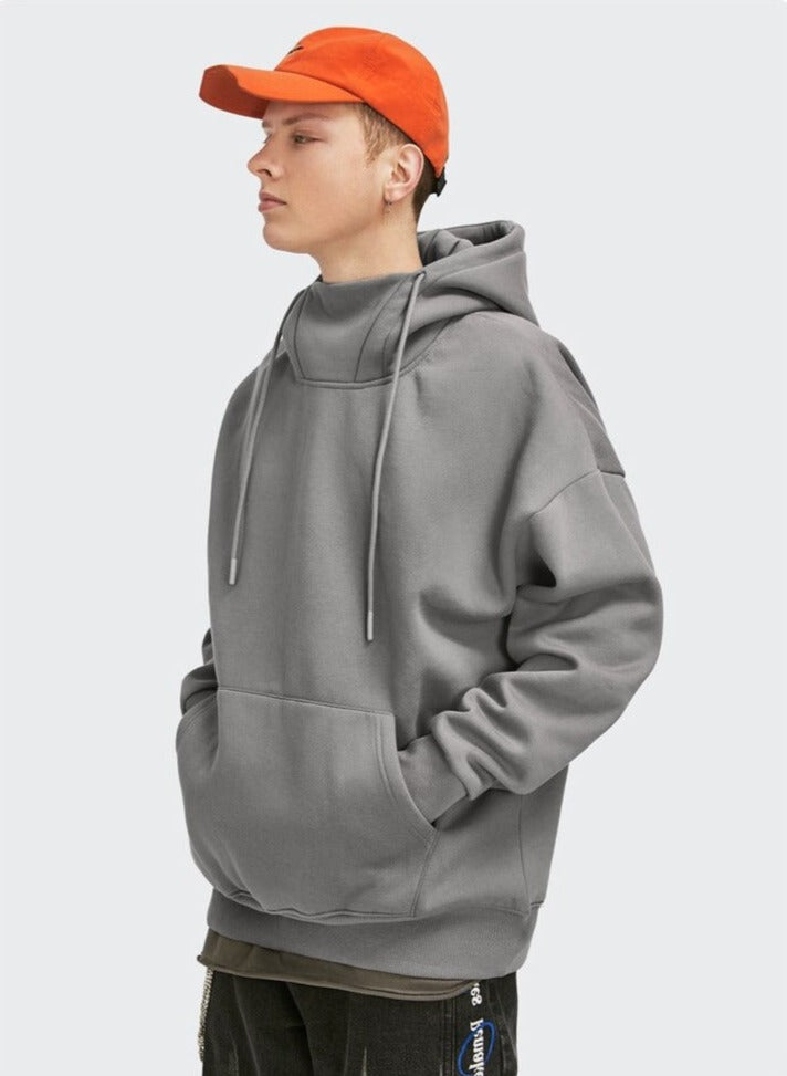 boy in a grey DAXUEN High Collar Solid Color Hoodie