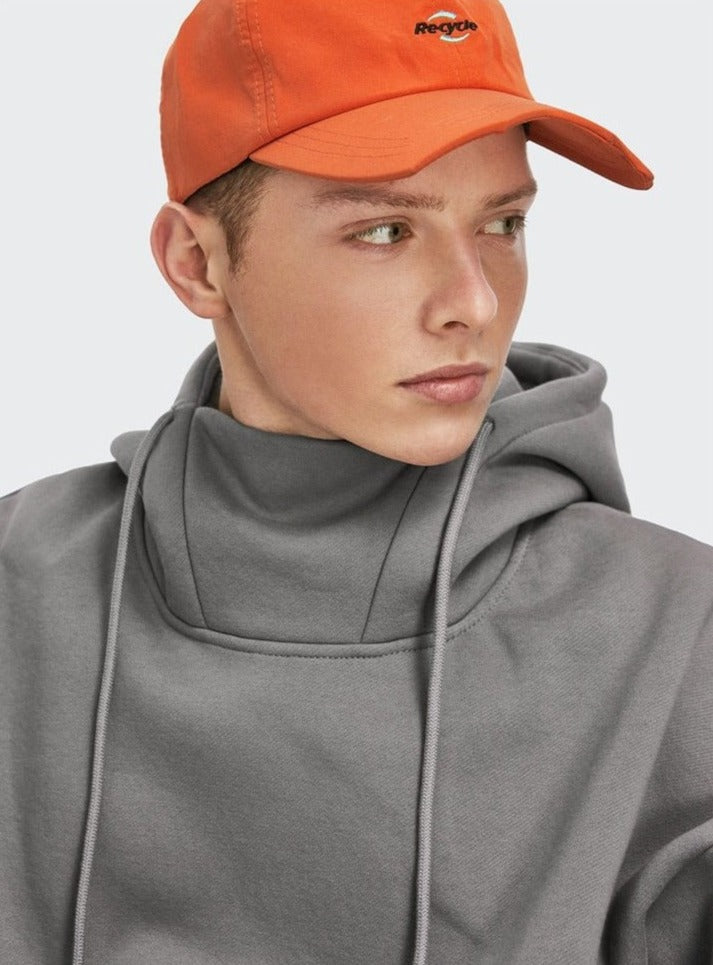 boy with an orange cap in a grey DAXUEN High Collar Solid Color Hoodie